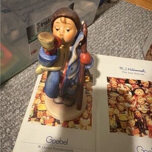 Goebel Child Figurine with Blue Coat and Red Bird
